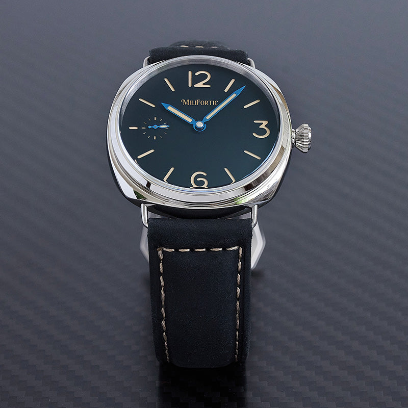 Manual wind watch with heat-blued hands and black strap