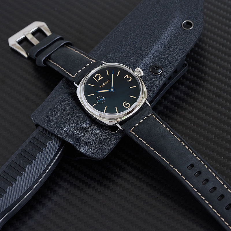 E064 watch lying flat on a knife model