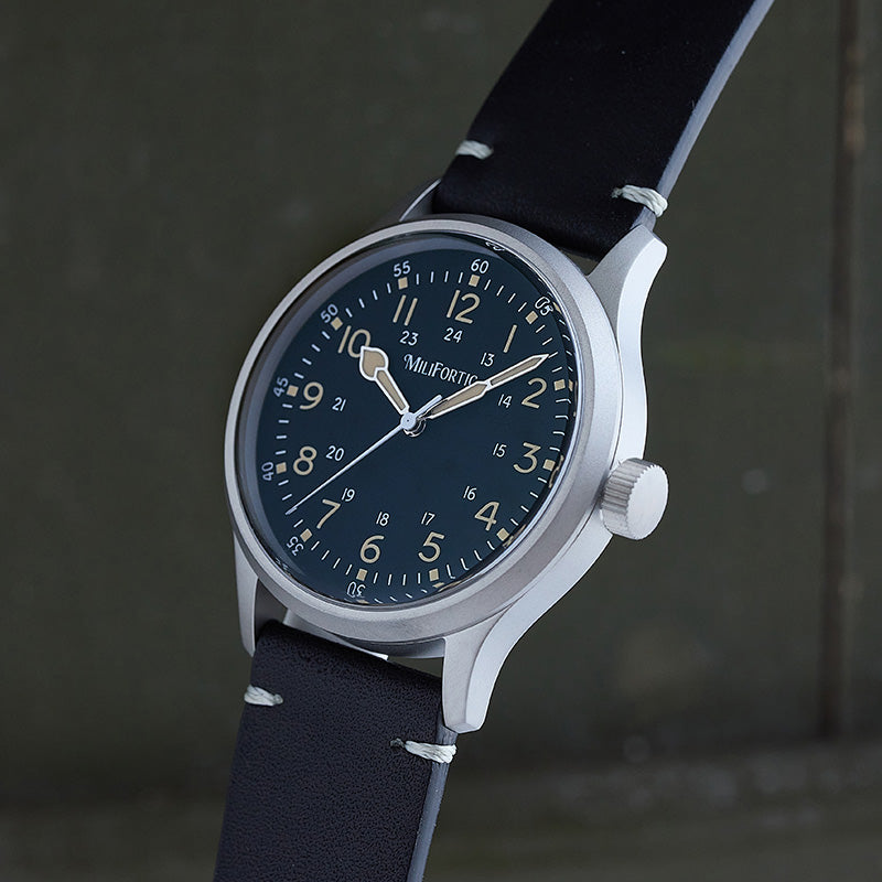 Watch side view with black dial and black strap