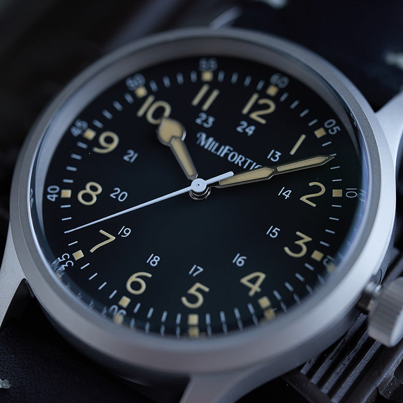 Dial details with 24-hour numerals, sapphire crystal, and Arabic numeral markers