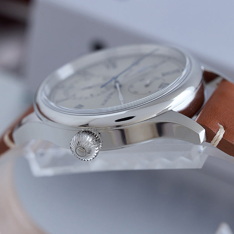 Watch side view with polished case and screw-down crown