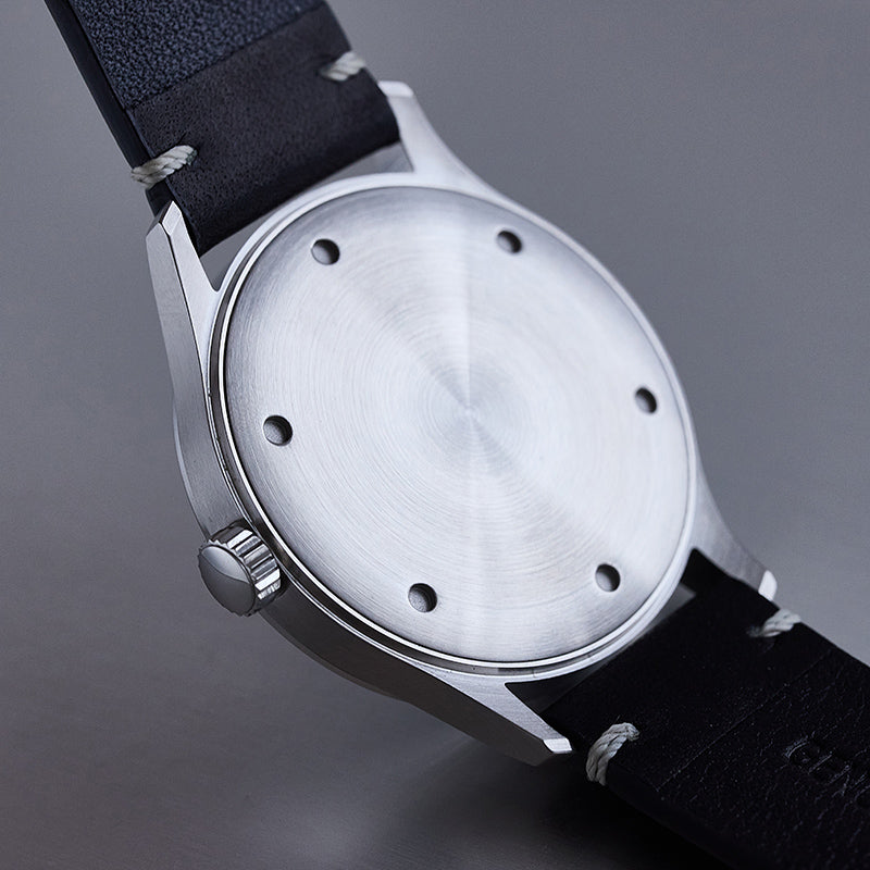 R078 watch with black strap, featuring a brushed finish on the back.