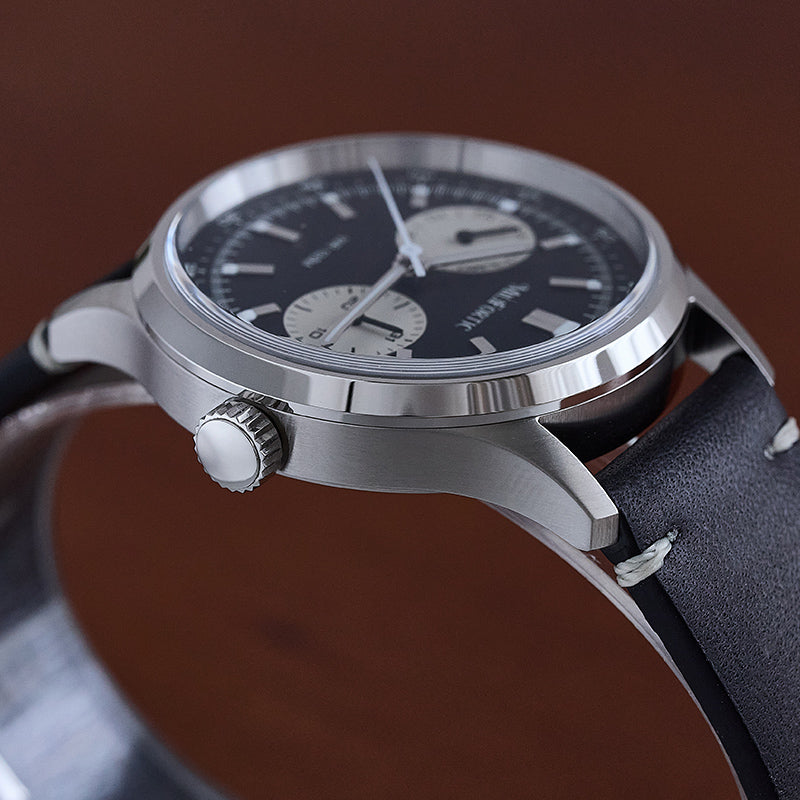 R078 watch with black dial, black strap, polished finish on the top of the case and brushed finish on the bottom.