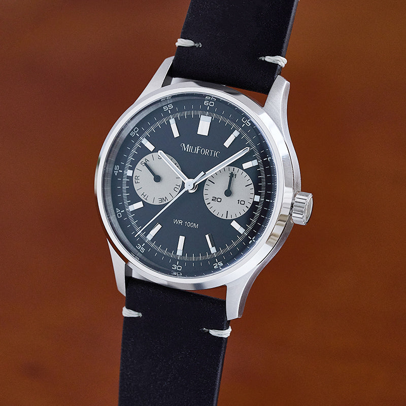 R078 watch with solid black dial and black leather strap.