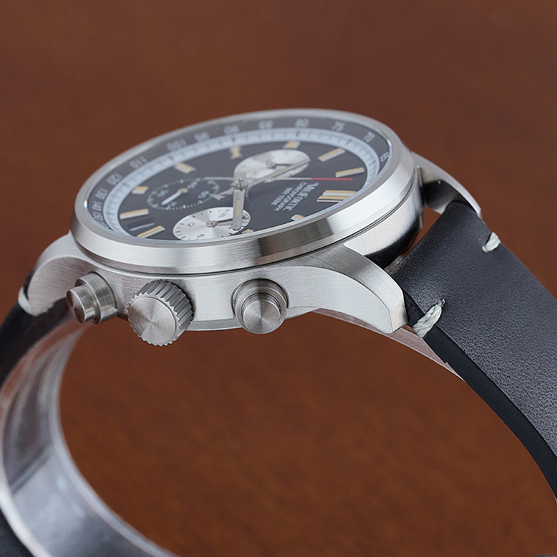 Chronograph watch with side view, featuring a brushed finish bezel and brushed crown