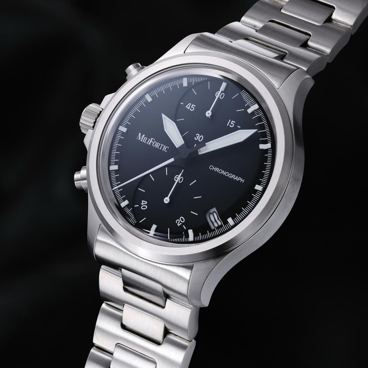 Black two-register chronograph dial with date at 4:30 and lume-filled hands